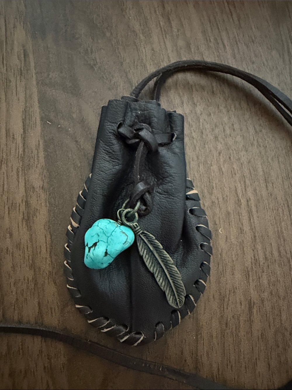 Handmade leather medicine bag with Turquoise Stone and Feather Charm